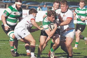 Paddy Taylor Naas RFC breaks out of the tackle of David Walsh and Artur Smykovskiy Dublin University RFC in the Energia All -Ireland League Div 1B Rugby game, Photo by Martin Rowe