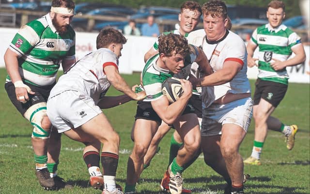 Paddy Taylor Naas RFC breaks out of the tackle of David Walsh and Artur Smykovskiy Dublin University RFC in the Energia All -Ireland League Div 1B Rugby game, Photo by Martin Rowe