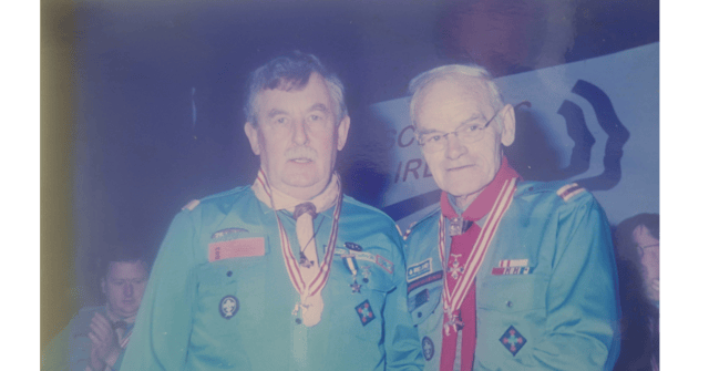 John Casey being presented with the Silver Wolfhound award by chief Scout Peter Dickson at a national scouting conference. It is the highest honour Scouting Ireland can award