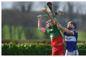 PJ Scully, Borris-Kilcotton, securing this sliotar as John Gaughan, Castletown, challenges Photo Denis Byrne
