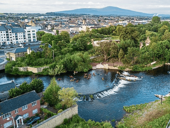 An aerial shot of Lady Blessington's Baths with Clonmel town centre behind and Slievenamon in the distance.