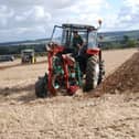 A ploughman taking part in a competition.