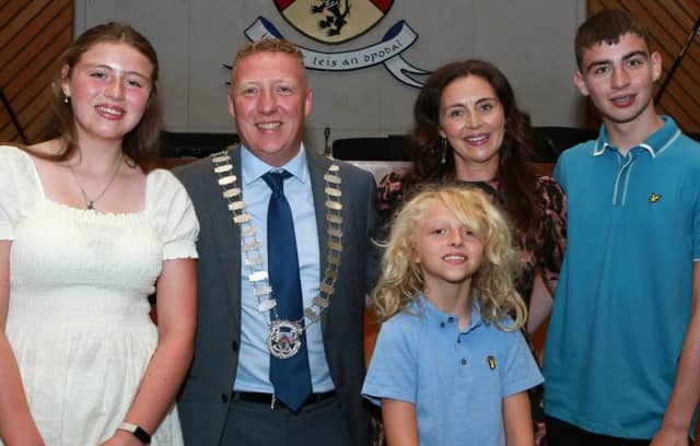 Cllr Barry Walsh, Cathaoirleach of Laois County Council with his wife Gemma and children Ellie, Oisin and Cillian in council chambers.