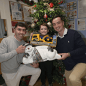 Four ice cool customers: Hurling stars Aaron Gillane and Kyle Hayes gift a truck and digger to Nathan Gleeson, Raheen, during a visit to the Children's Ark in UHL I PICTURE: Dave Gaynor