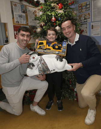 Four ice cool customers: Hurling stars Aaron Gillane and Kyle Hayes gift a truck and digger to Nathan Gleeson, Raheen, during a visit to the Children's Ark in UHL I PICTURE: Dave Gaynor