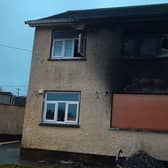 The burned out remains of the house in Edenderry where a woman and a young child died on Saturday night