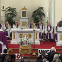 Gifts brought to the altar included a treasured family photo