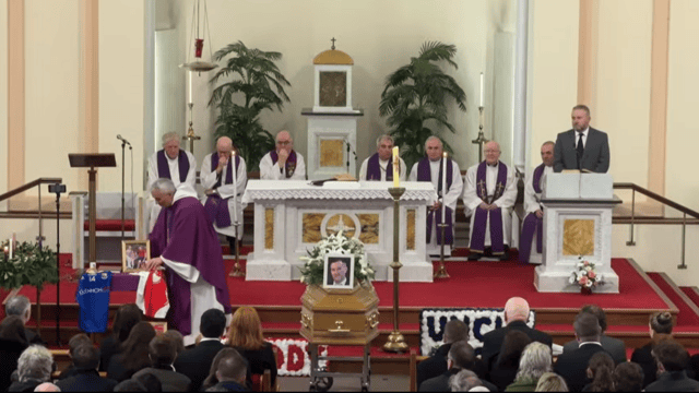 Gifts brought to the altar included a treasured family photo