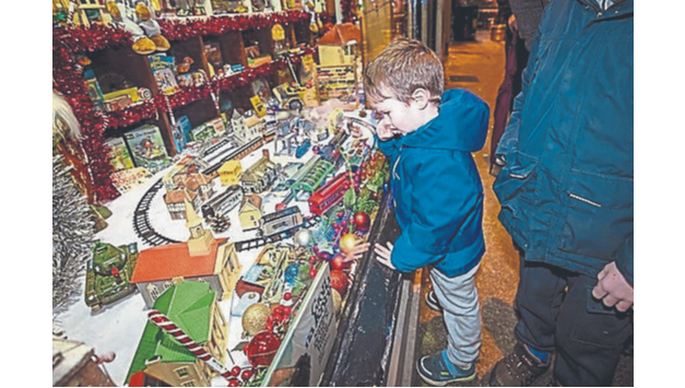 Conan Gallagher  only has eyes for the train set as he admires the incredible range of vintage toys       PICTURE: Kieran Ryan-Benson