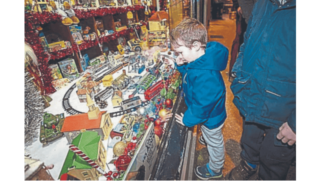 Conan Gallagher only has eyes for the train set as he admires the incredible range of vintage toys PICTURE: Kieran Ryan-Benson