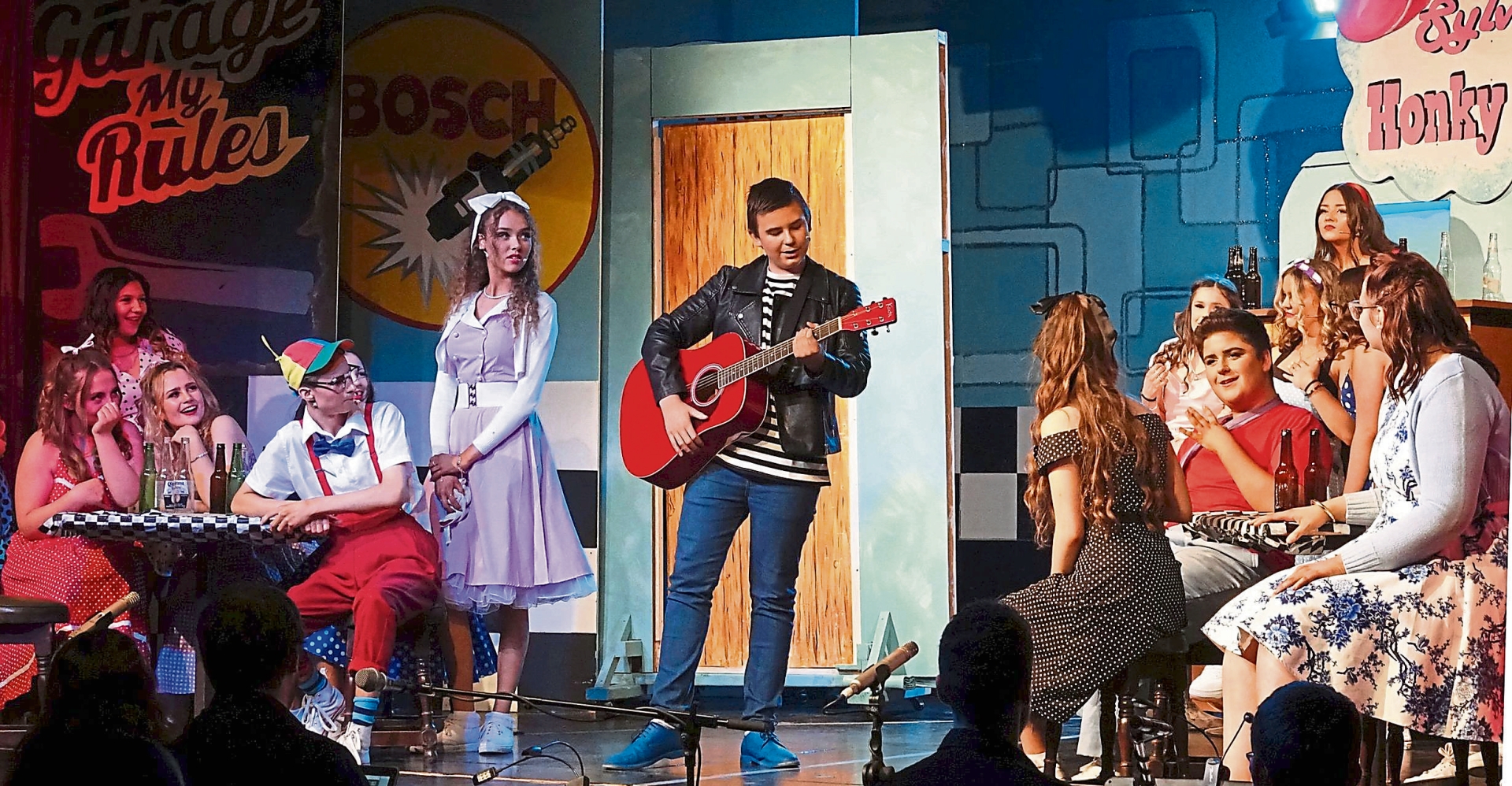 Matthew Ryan stars as Chad at Sylvia's Honky Tonk in the Coláiste Íosagáin Portarlington 2023 show All Shook Up - the Musical.  Photo: Michael Scully