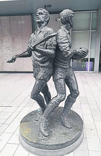 Puc and Ruck:  The dynamic bronze figures on O'Connell Street evoke the pride and passion of Limerick’s storied hurling and rugby traditions