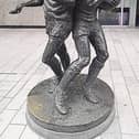 Puc and Ruck:  The dynamic bronze figures on O'Connell Street evoke the pride and passion of Limerick’s storied hurling and rugby traditions