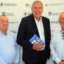 Pictured with Packie Bonner at the recent launch of the ‘Working Over By’ exhibition in the County Museum in Letterkenny are Dr. Paddy Fitzgerald and Dr. Liam Campbell from the Mellon Centre for Migra