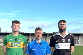 Team captains Fred Kelleher (Tubberclair) and James Culleton (Mullinavat) with match official Lar Murphy before Sunday’s game at the Downs.