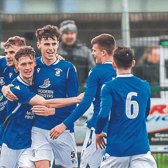Joe Banville (second from left) continued his goalscoring streak for Freebooters on Saturday night