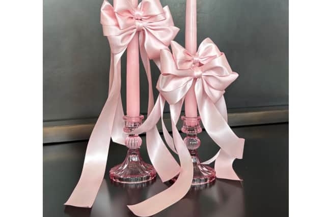 Think ribbons tied around a ballet slipper, and how that’s inspired into home décor, suggests Johnson. “Ribbons on wreaths to hang on your door; or ribbons you can tie onto candles.”
