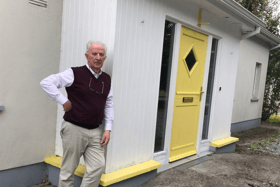 Tom Roche outside his home in Rhode