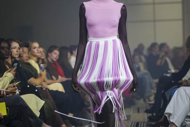 Lilac and white skirts hung with long threads that caught every step; a mint green skirt was gathered to swell, yet fell into clean panels so the movement did not feel chaotic.