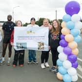 Kayode Adebesin with his supporters at the finish line. All photographs by Martin Connelly