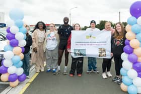 Kayode Adebesin with his supporters at the finish line. All photographs by Martin Connelly