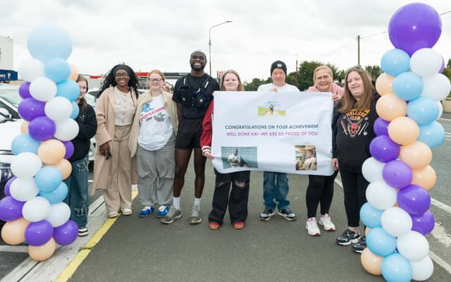 Kayode Adebesin with his supporters at the finish line. All photographs by Martin Connelly