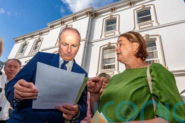 She confronted the Taoiseach as he arrived for the Fianna Fail think-in in Cork and said she had first contacted his office 15 years ago.