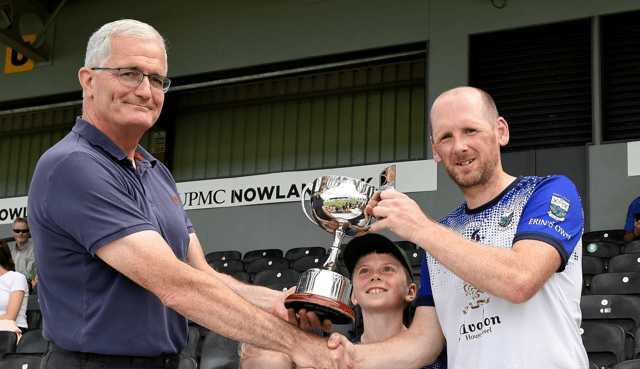 Erin’s Own captain Damien Fogarty receives the trophy. Picture: Willie Dempsey