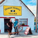 David Brennan presenting his spinning wheel to Pat Doherty, Doagh Famine Village