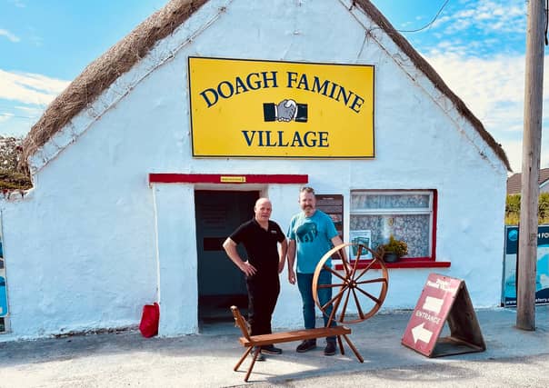 David Brennan presenting his spinning wheel to Pat Doherty, Doagh Famine Village