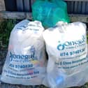 Bags dumped on the road next to Davy Brennan Memorial Park