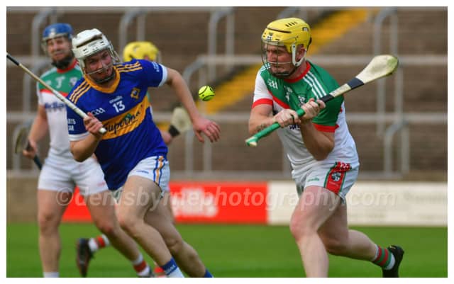 Shane Madden, Rathdowney Errill playing this sliotar clear on Saturday. Photo Denis Byrne