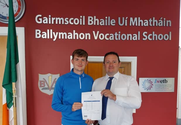 Eoghan Duncan picking up his results with Ballymahon Vocational School Principal Mr Mick O'Rourke