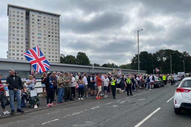 Anti-racism demonstrators stage counter-protest outside asylum seekers ...