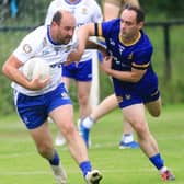 Ballinderry Darren Lawn tackled by Steelstown Brian Ogs Gareth Logue.  (Photo - Tom Heaney, nwpresspics)