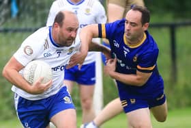 Ballinderry Darren Lawn tackled by Steelstown Brian Ogs Gareth Logue.  (Photo - Tom Heaney, nwpresspics)