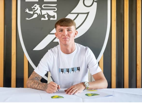 Glenn McCourt has signed a three-year deal with Norwich City.