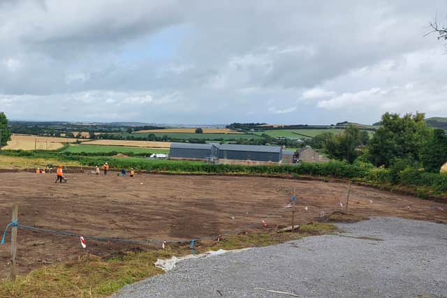 The field has distinct areas of darker colours, which he explains prove there was a high bank at one end, dug painstakingly deep to keep out wild animals or intruders. 