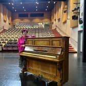 Colette O'Sullivan with the piano which has been donated to Esker Arts