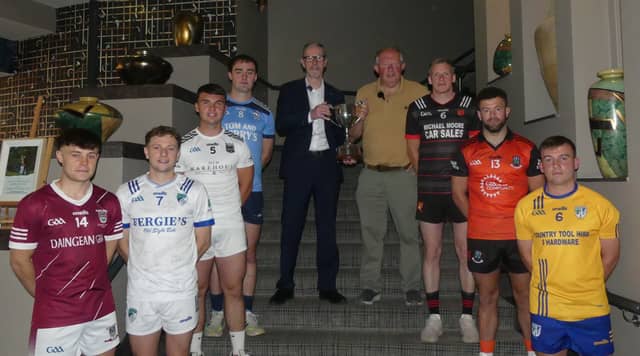 Senior "B" football captains with Offaly GAA chairman Tom Parlon and the sponsors