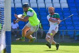 Stephen Kelly, Rosenallis bravely saves Mark Kavanagh, Rathdowney Errill   Photos: Denis Byrne