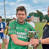 St Lachtain’s captain Darragh Quinn receives the Junior F League trophy from  Pat Cooney.  Picture: Willie Dempsey
