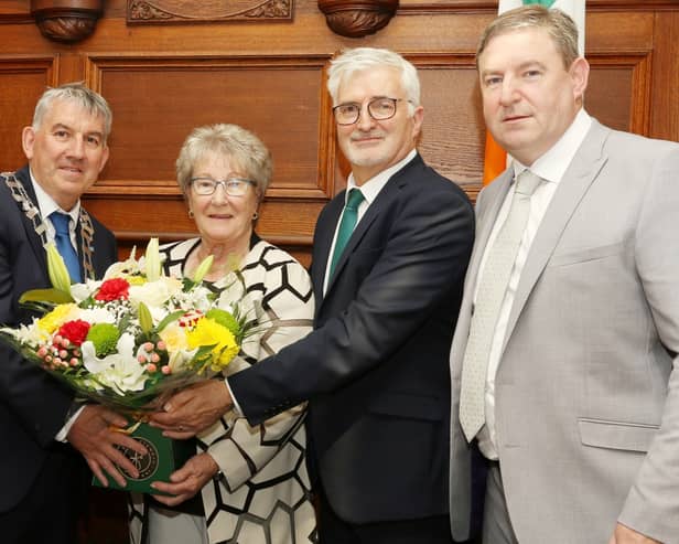 Paul Canning and John McLaughlin of Donegal County Council make a presentation to Margaret Blaney with Cllr Liam Blaney and Senator Niall Blaney. Photo: Thomas Gallagher