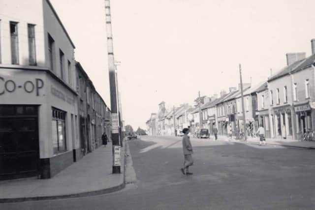 Developed over the period from 1800 to 1825 it could be described as the opening to the canal quarter facilitating access to the new streets at Deane Place, Market Square, Chapel Street, Store Street, Gas Works Lane and O’Carroll Street. Surprisingly for such a great artery it was never an important trading street. The harbour takes up much of the eastern end of the street together with the great distillery of the 1820s – now the Granary apartments. The original name here was Charles Street and this can be seen carved in stone on the corner with O’Carroll Street.