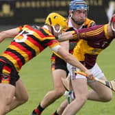 Éire Óg centre-back James Dolan breaks past the Ardclough duo of Sean Whelan and Tim Ryan during the UPMC Senior Hurling Champions round 1 game against Ardclough, Photo by  Sean Brilly