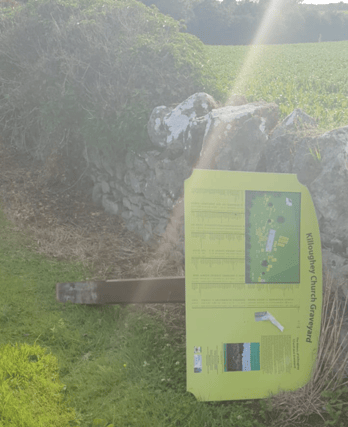 The stolen sign was left at the perimeter wall of the old graveyard
