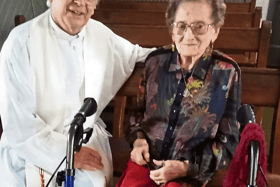 Nora O’Mahony celebrating her recent birthday with Callan parish priest, Fr Willie Dalton