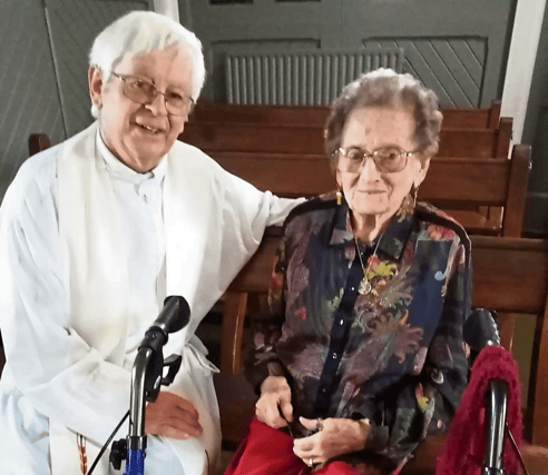 Nora O’Mahony celebrating her recent birthday with Callan parish priest, Fr Willie Dalton