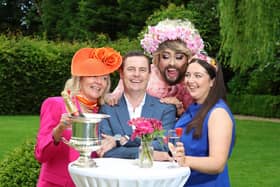 James Patrice, appearing as his iconic character, ‘Malahide Woman’ and former Jockey Fran Berry  with Tina Buckley of the Keadeen Hotel (left) with daughter Holly Keogh