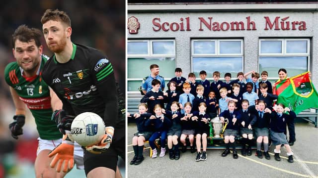 Shaun Patton, of Donegal, and the students of St Mura's National School in Tooban were shocked when Garda McGreal unfurled a Mayo GAA flag. Pic: Sportsfile/An Garda Síochána Donegal